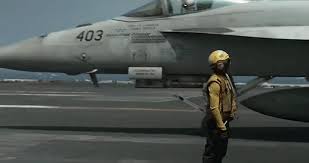U.S. Fighter Jets Launch from USS Abraham Lincoln