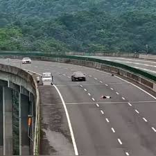 Woman Steps Out of Car and Lies Down on Highway