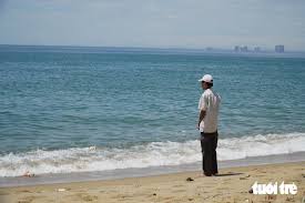 Mother Waits on Beach for Missing Child in Nghê Cape