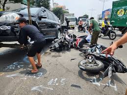 Car Collides with Motorcycles at Red Light in Ho Chi Minh City