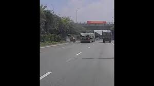 Passenger Van Overturns After Collision with Truck